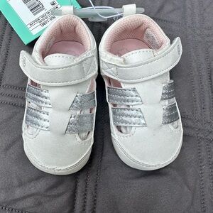 Baby’s white shoes by stride rite